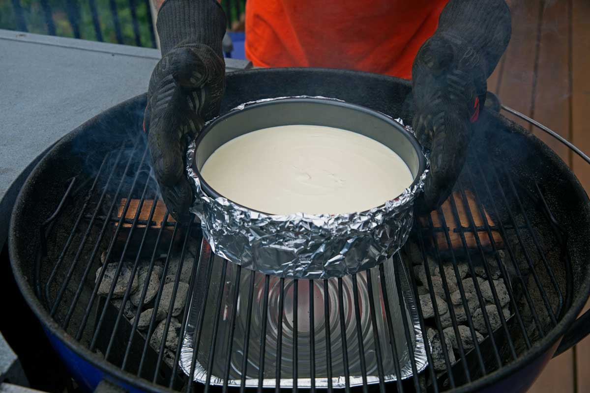 placing cheesecake on the grill