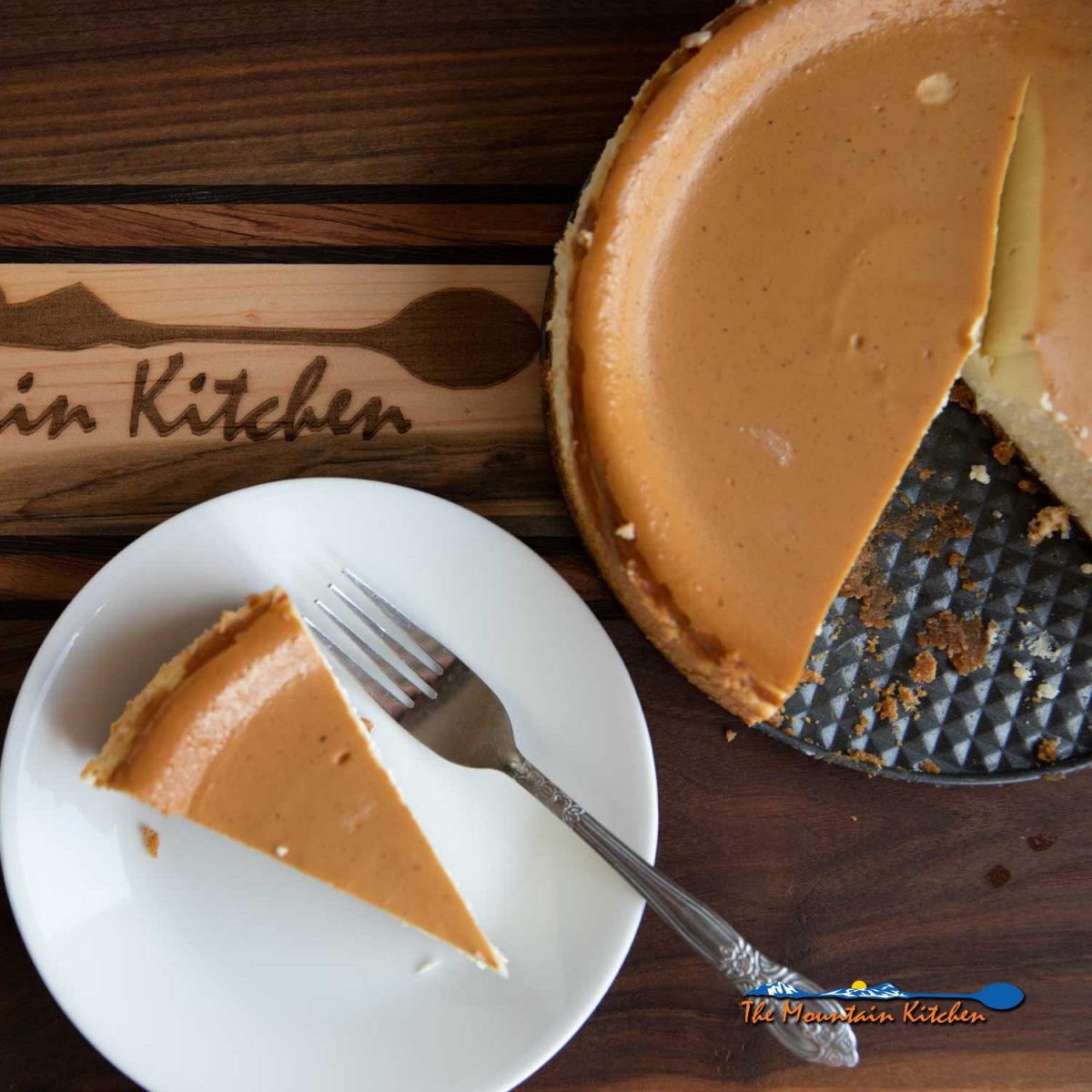 slice of smoked cheesecake on plate with fork