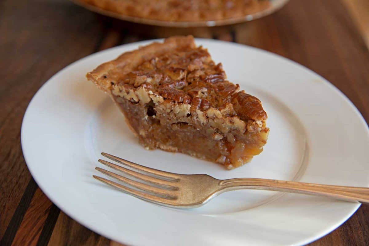 slice of smoked pecan pie with fork