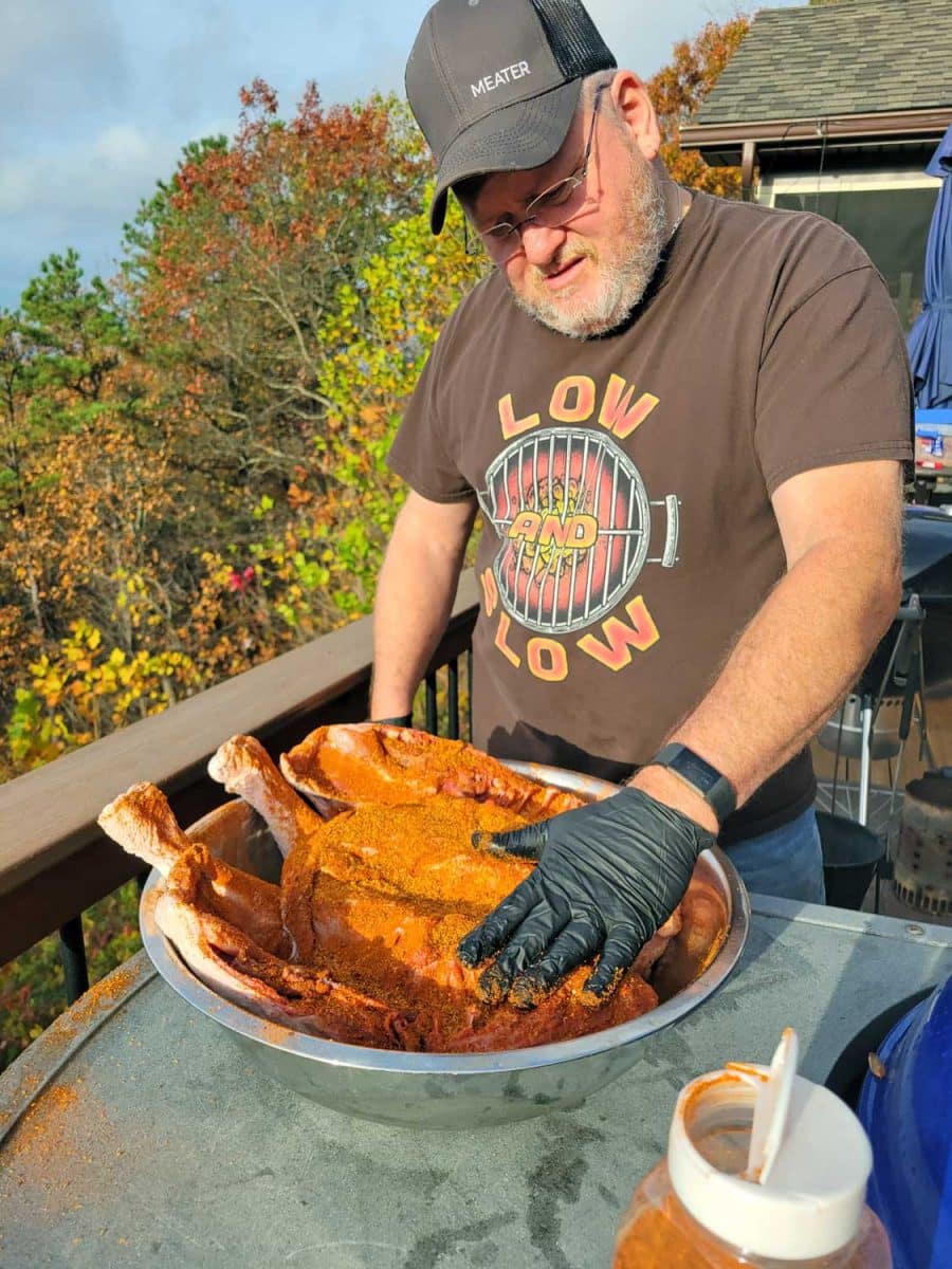 David rubbing turkey with bbq dry rub