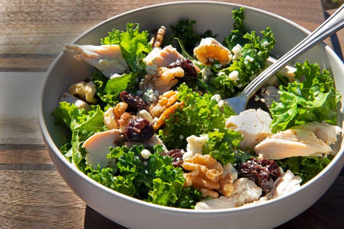 kale salad in bowl with leftover turkey