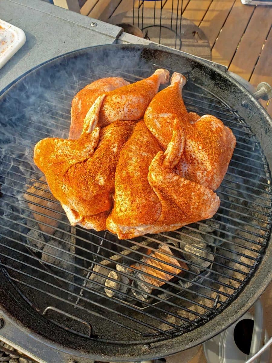 rubbed turkey smoking on grill