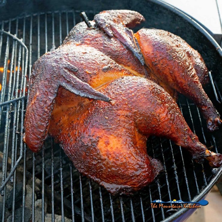 smoked spatchcock turkey smoking on grill