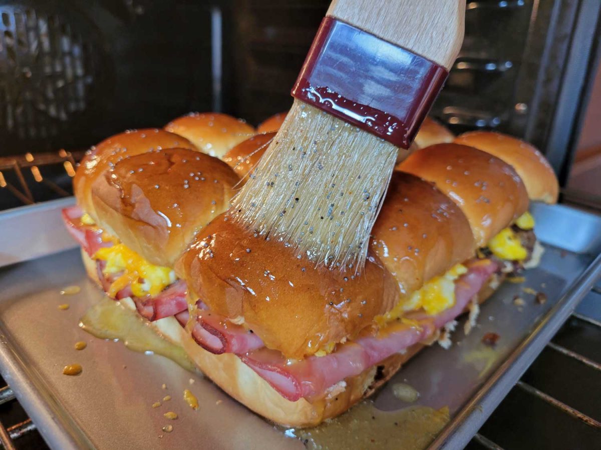 brushing sliders with honey butter