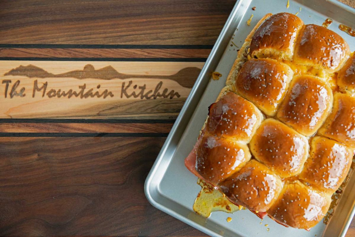 sheet pan of sliders on cutting board