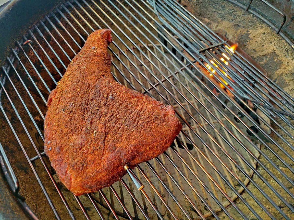 tri tip smoking on grill over indirect heat