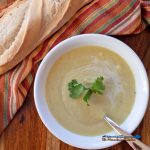 creamy turnip soup in bowl with bread