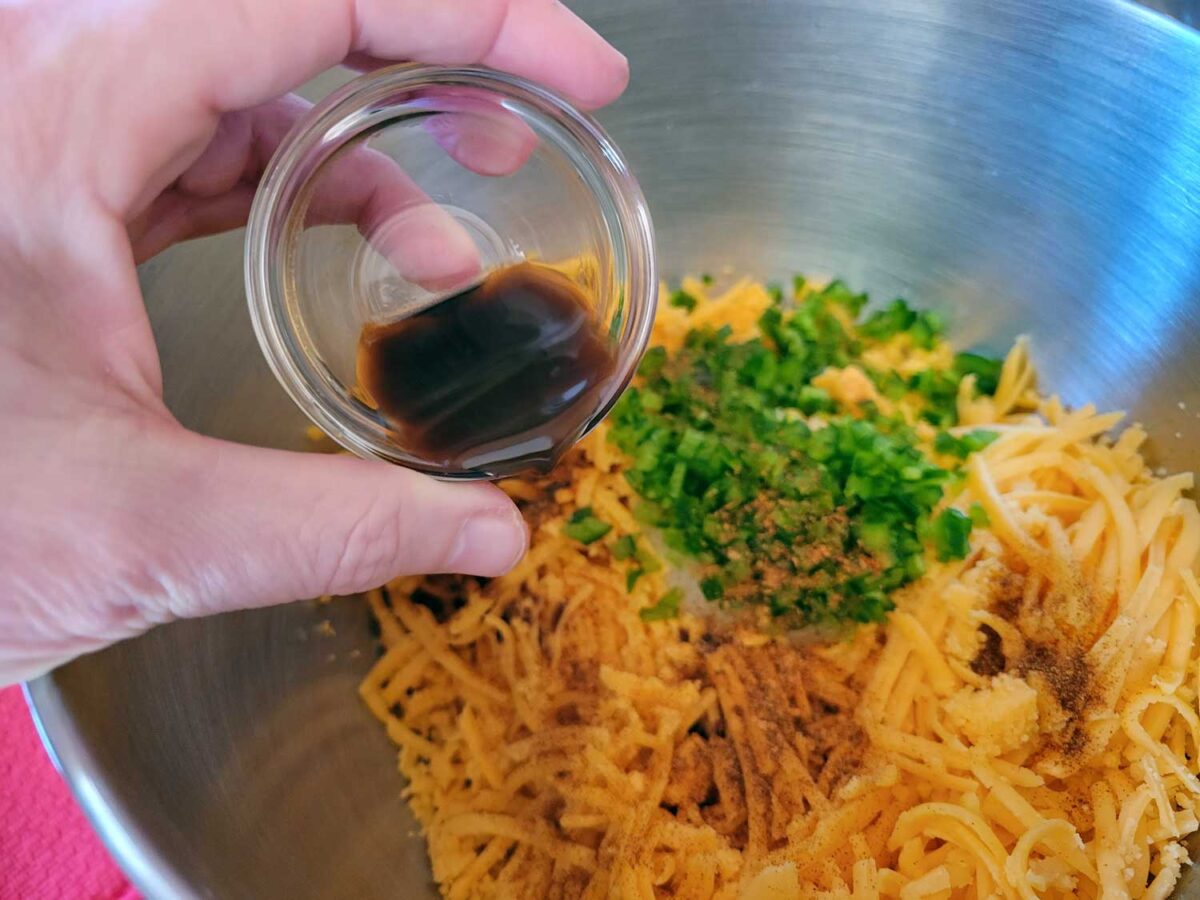 pouring worcestershire sauce into mixing bowl