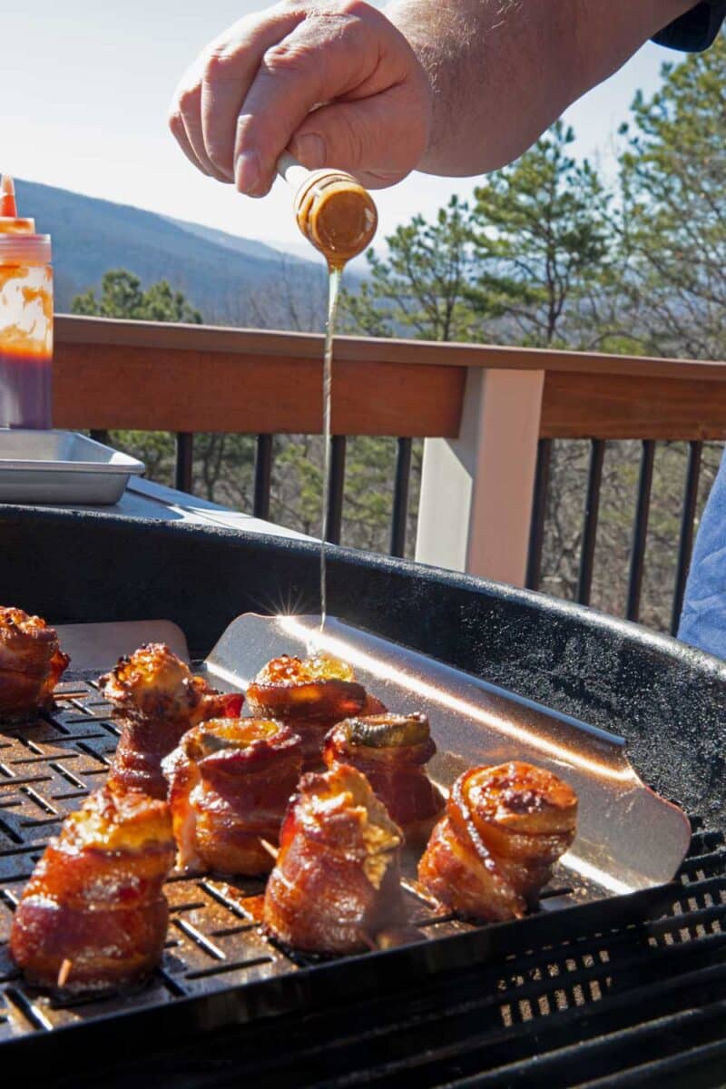 drizzling honey onto the pig shots