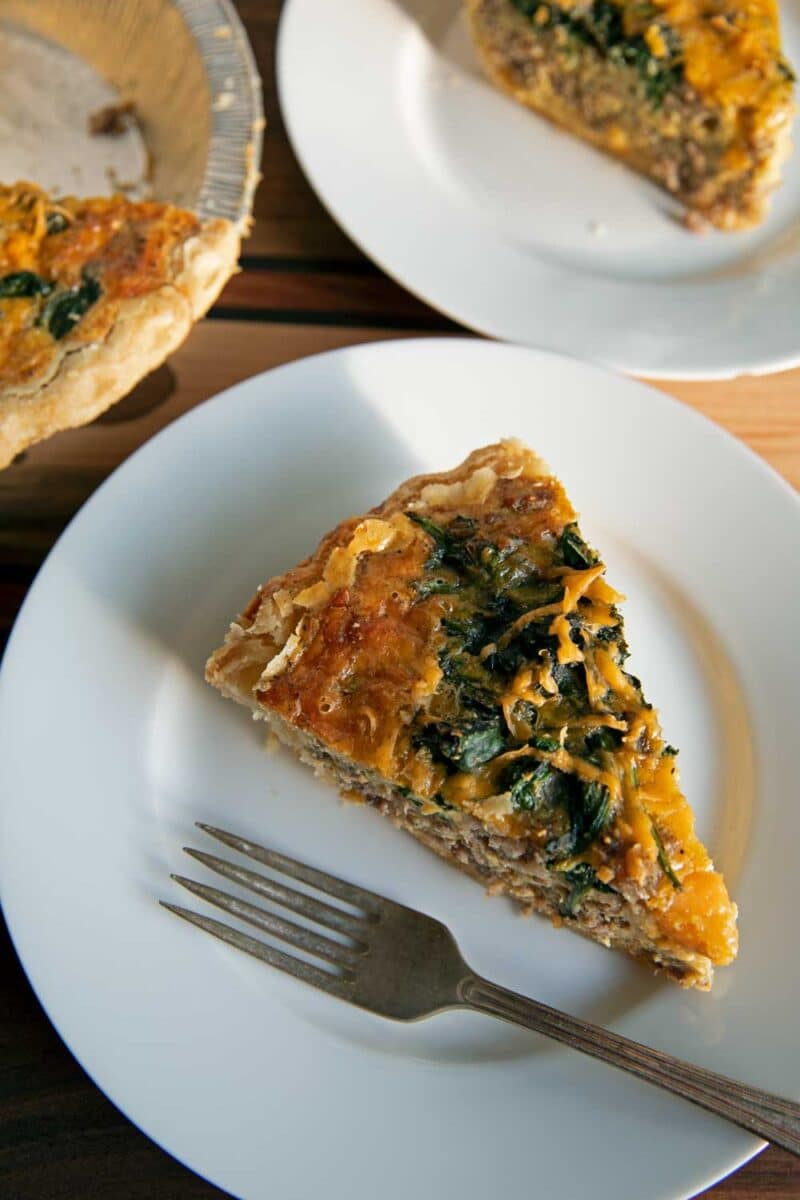 sliced quiche on plate with fork