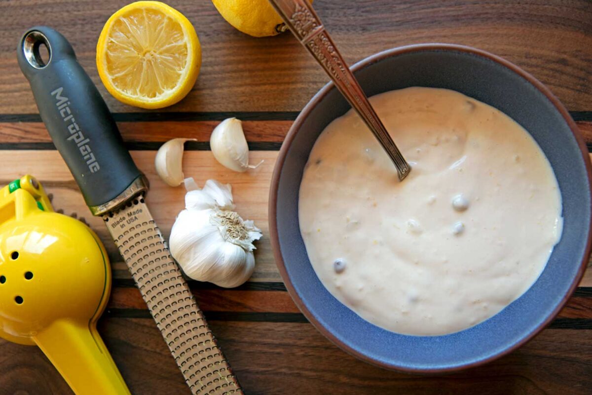 bowl of lemon aioli with ingredients