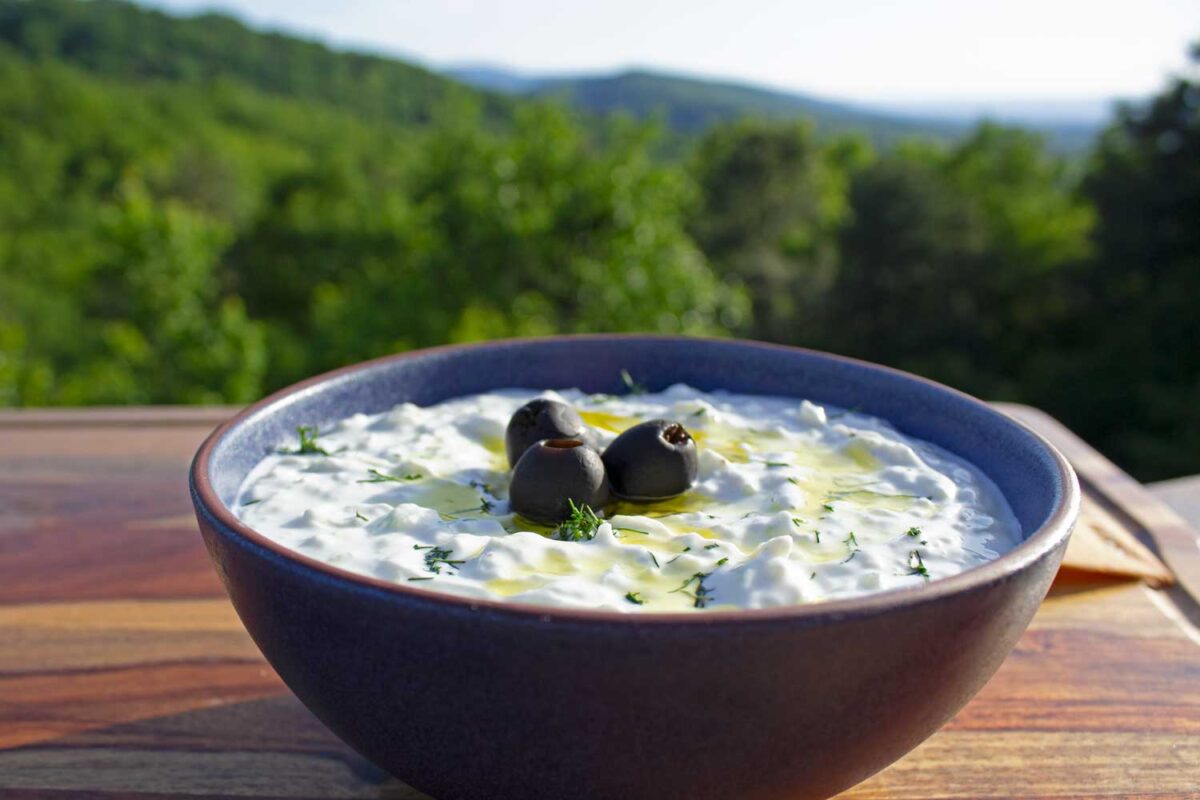 bowl of dip on cutting board