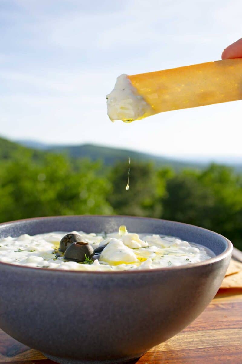 tzatziki sauce dripping from chip