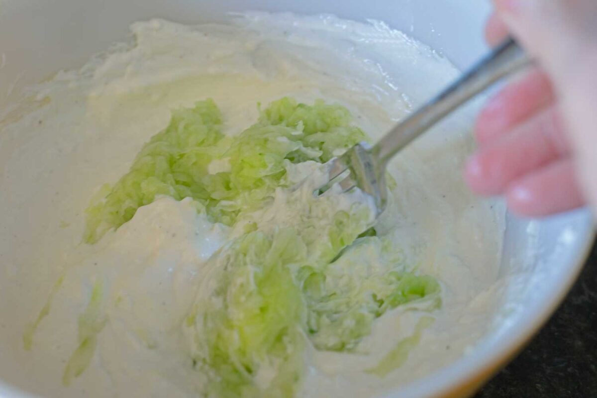 stirring cucumber into yogurt mixture