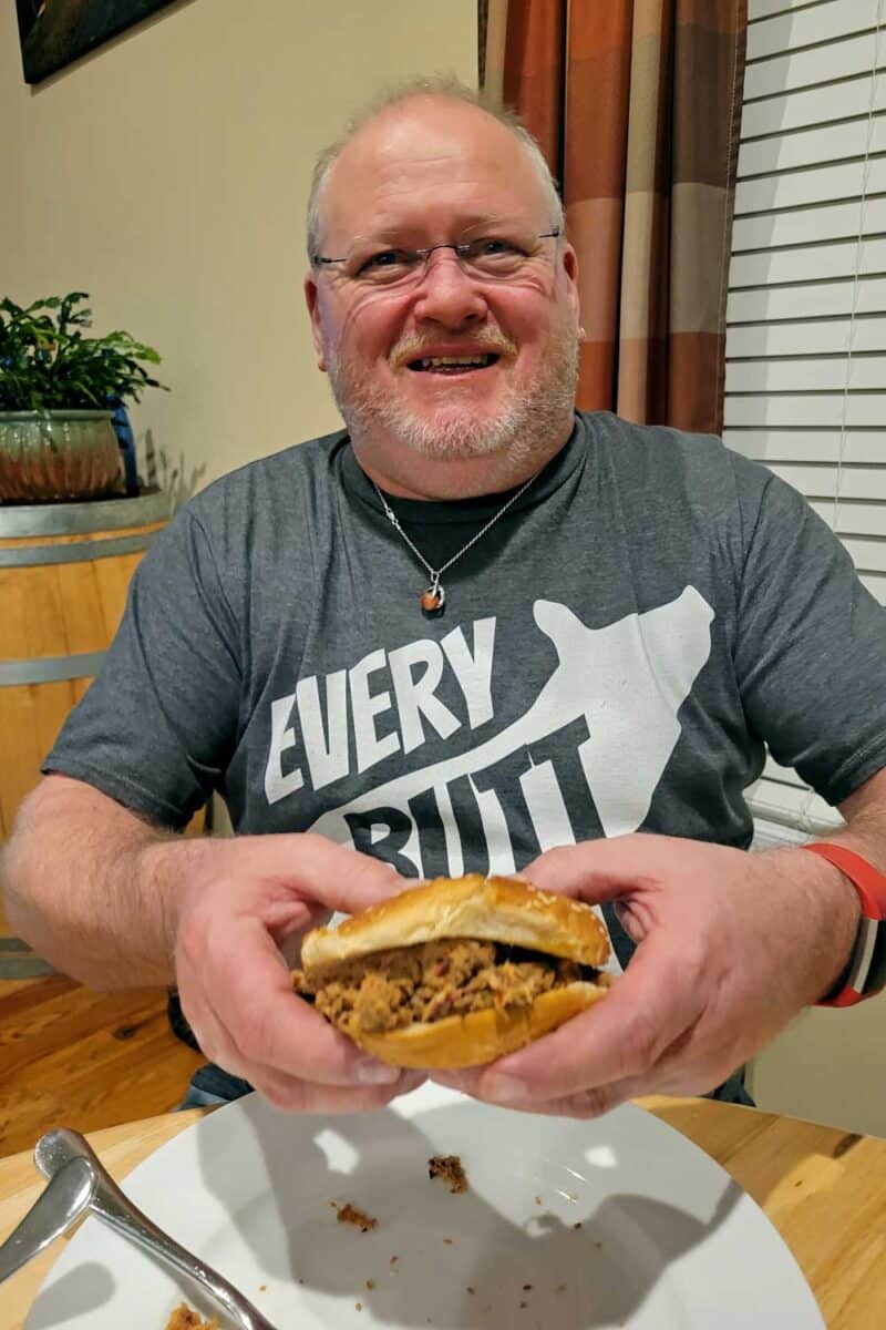 David enjoying a smoked pulled pork sandwich