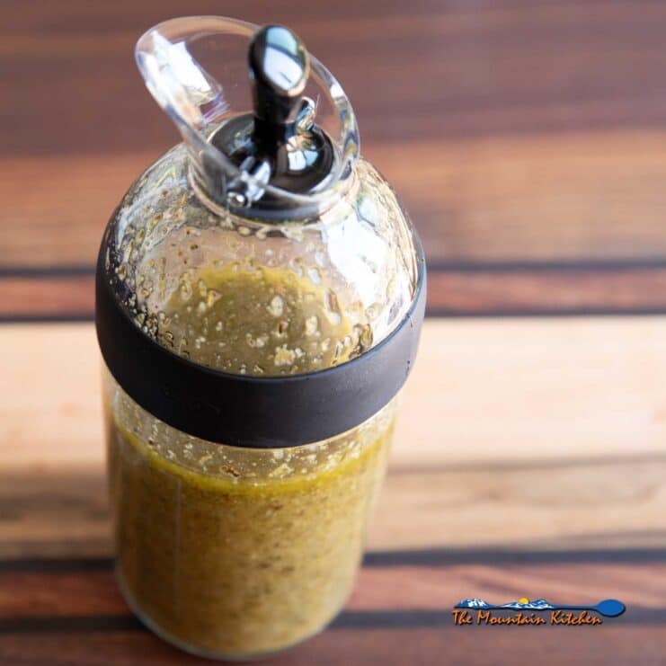 homemade greek salad dressing in shaker bottle