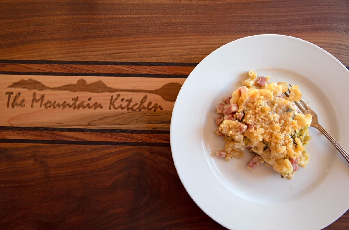 ham and broccoli mac and cheese served on plate with fork