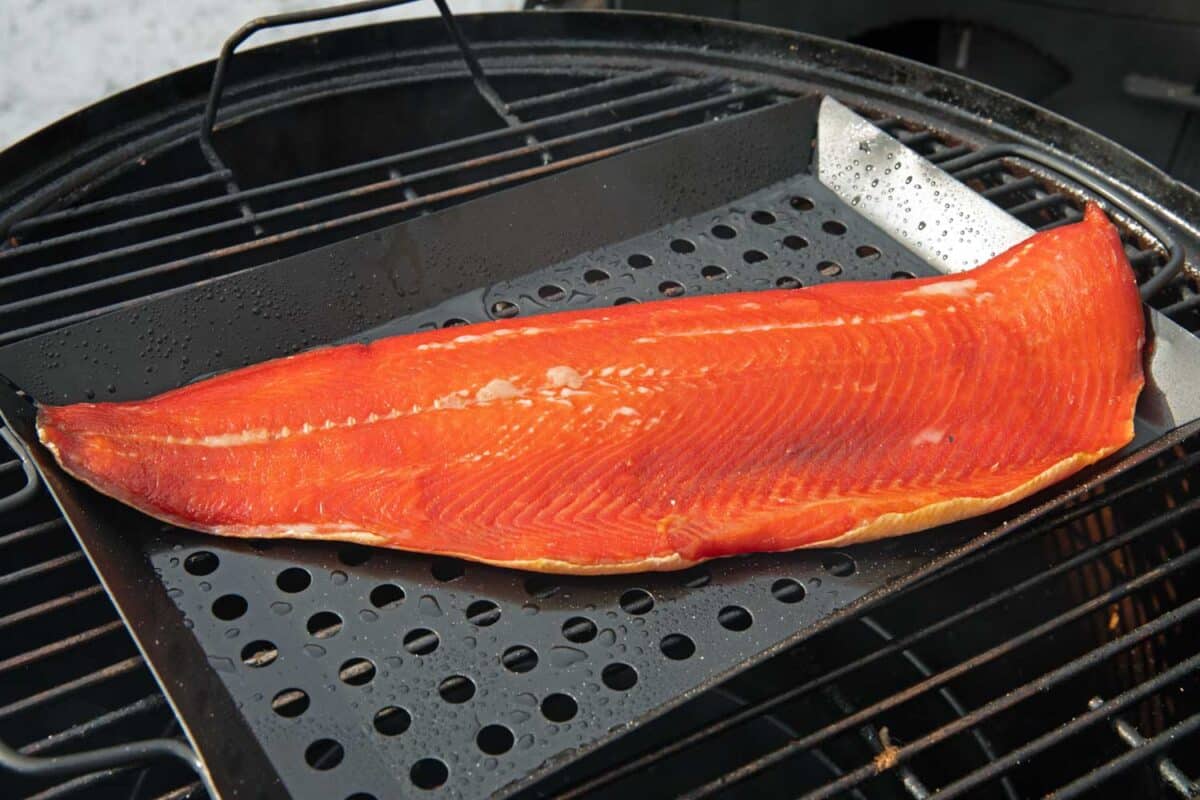 salmon on grill pan in smoker