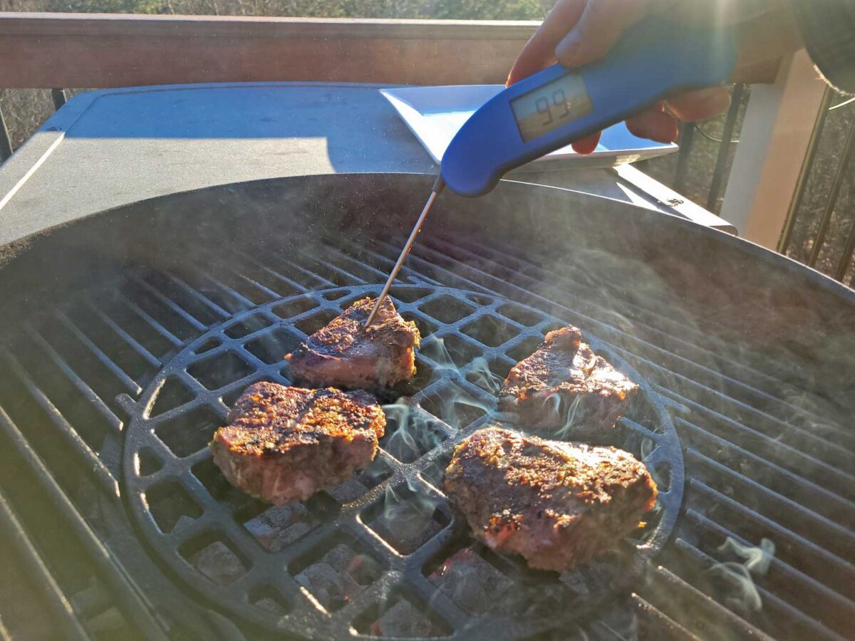 taking temperature of lamb with instant-read thermometer