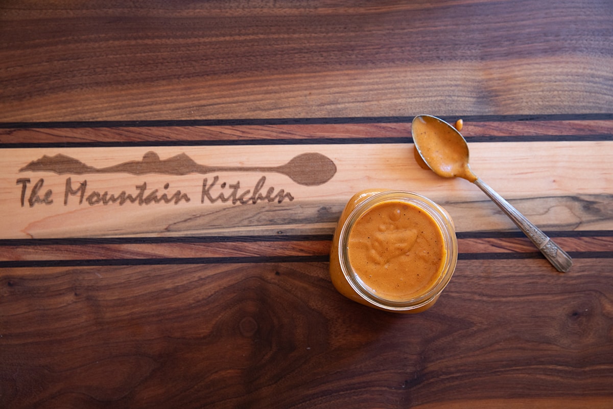 jar of chipotle bbq cheese sauce with spoon