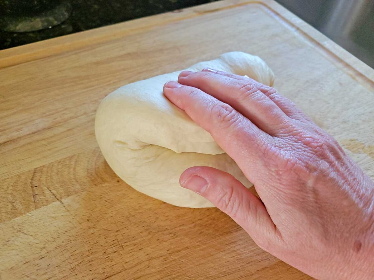 hand kneading bread dough