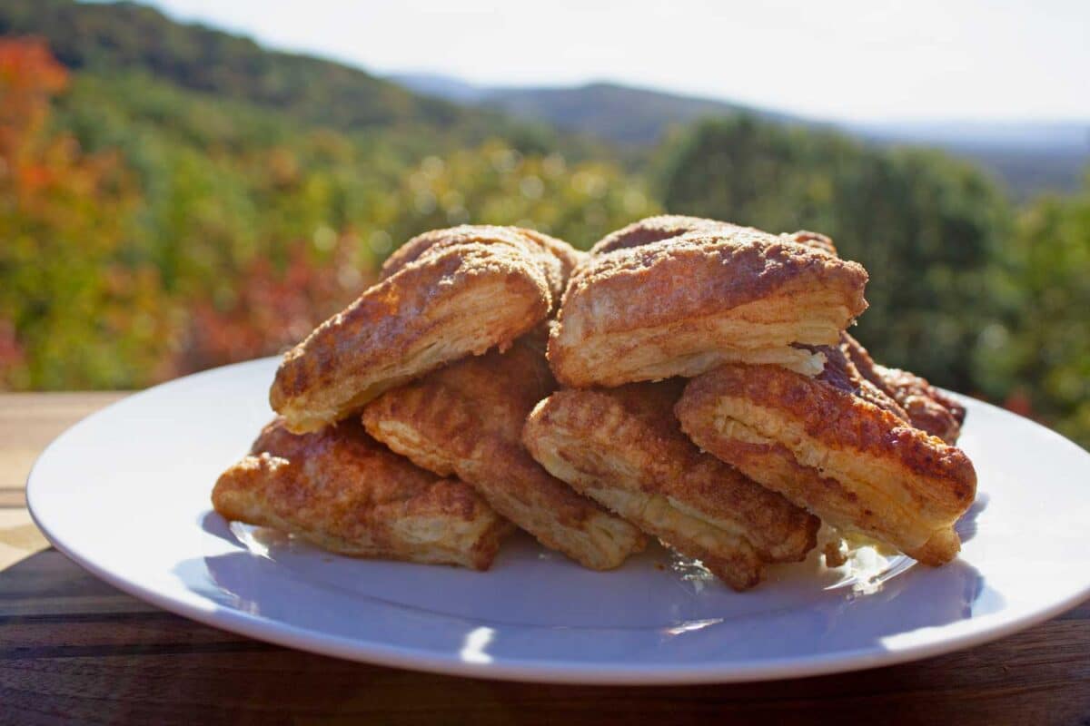 air fryer apple hand pies piled up on platter