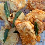 This crispy fried chicken recipe uses a brine, double coating, and vodka batter for a crust that stays crisp under a honey drizzle.